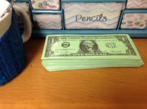My laminated "bank" of dollars. Also, check out my adorable mug that has a sweat coozy!
